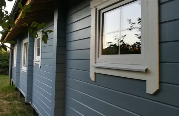 фото: покрытие фасада дома из бруса